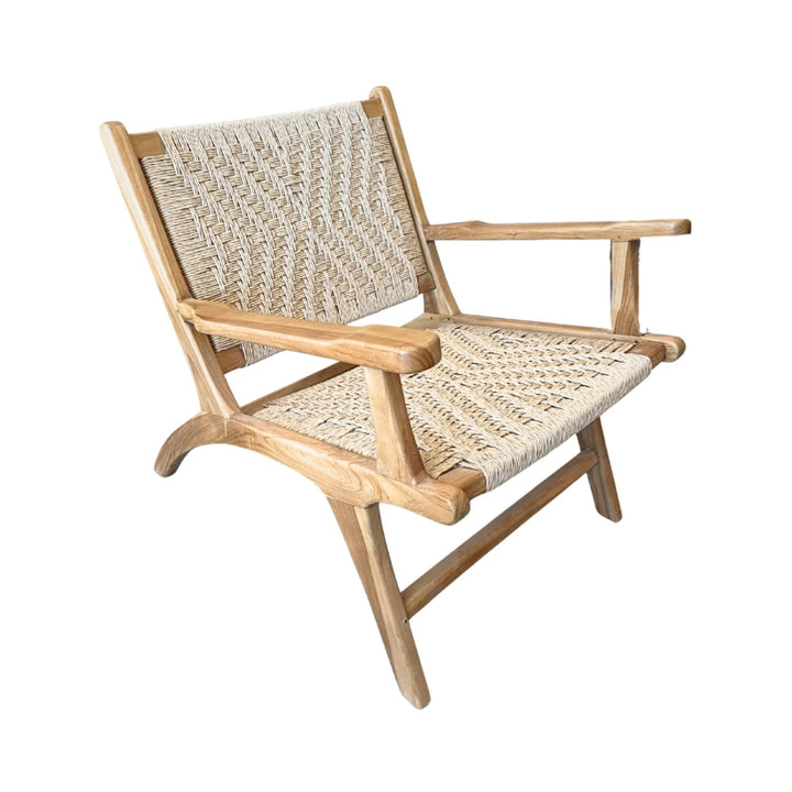Front angled view of Milaidhoo lounge armchair showcasing teak wood frame and woven rattan seat.