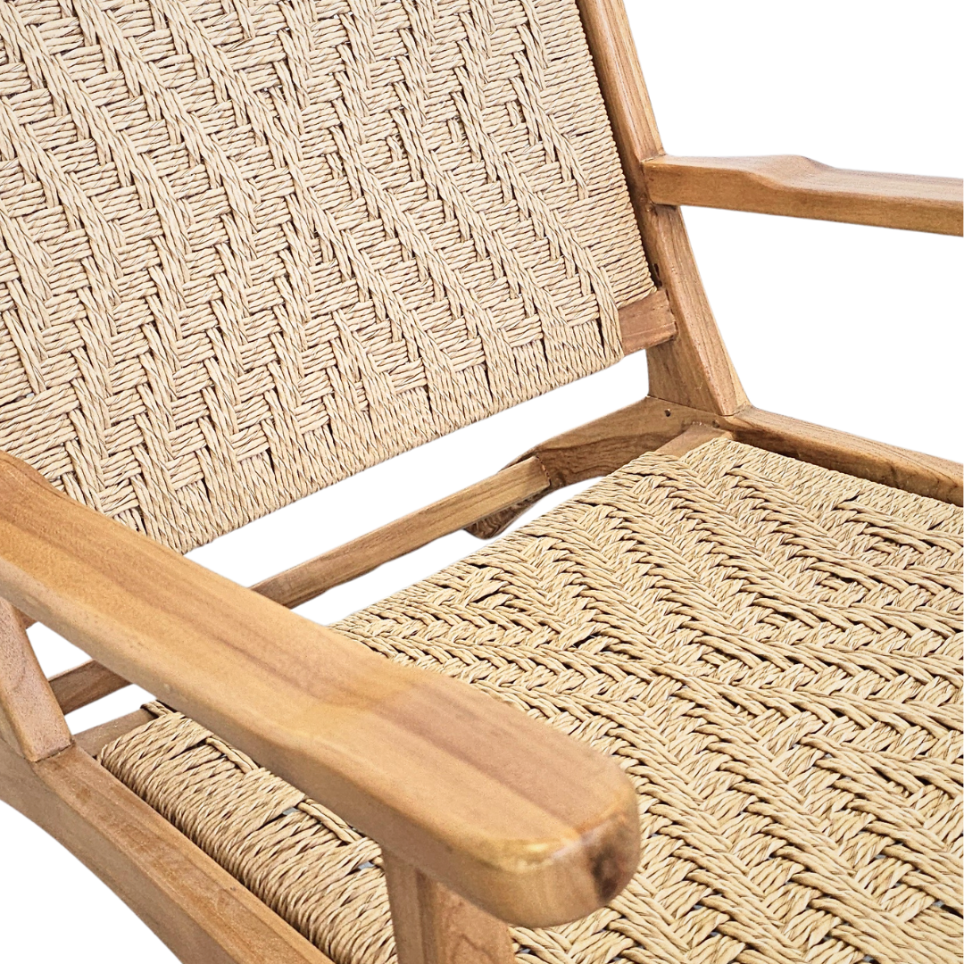 Close-up detail of the synthetic rattan weave on the Milaidhoo lounge armchair seat.