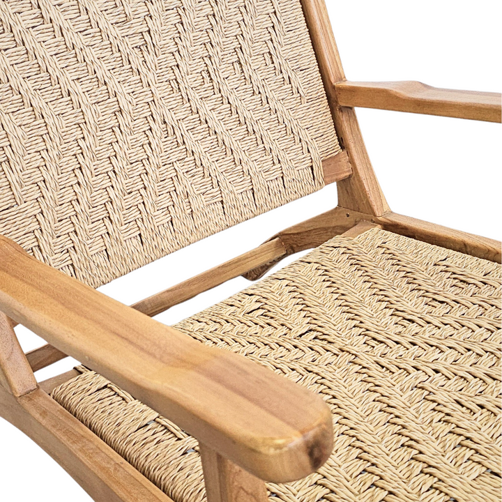 Close-up detail of the synthetic rattan weave on the Milaidhoo lounge armchair seat.