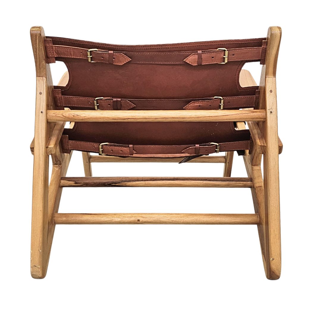 Back view of the Milaidhoo leather lounge armchair showing its sturdy wooden construction.