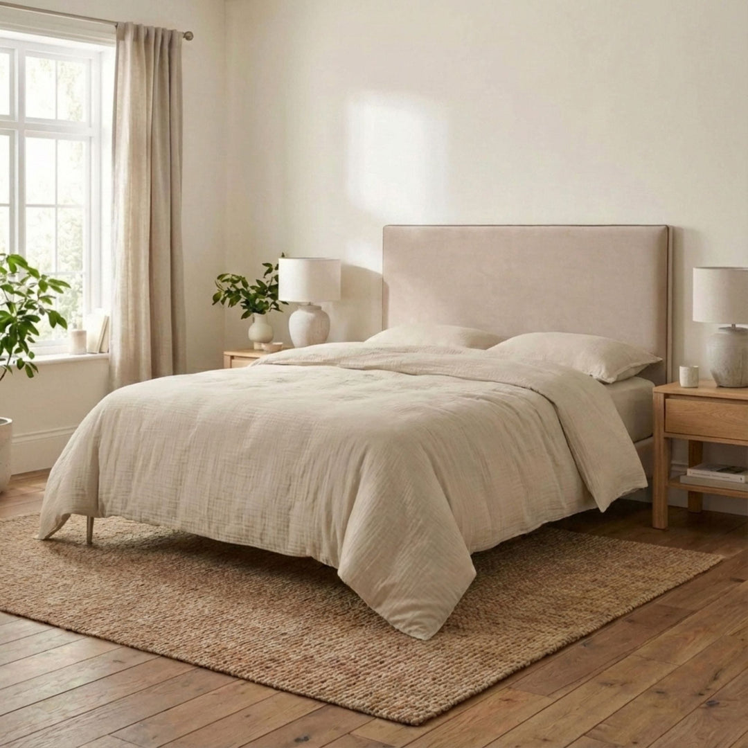Bedroom setting featuring the Milos duvet cover styled in a neutral, natural interior.