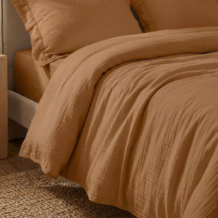 Close-up view of the Milos duvet cover highlighting its muslin cotton texture and soft drape.