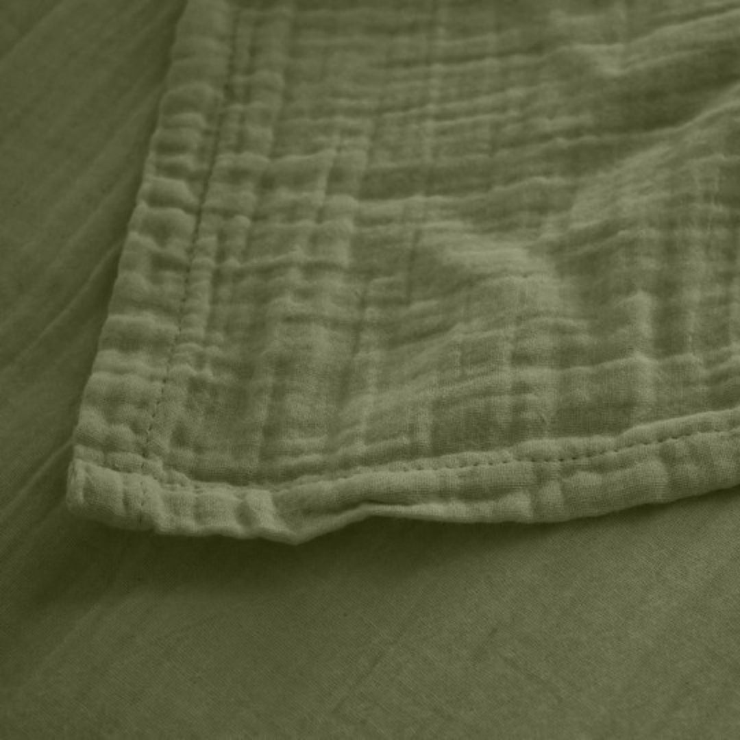 Detail of the Milos top sheet edge showing its lightweight weave and breathable fabric.