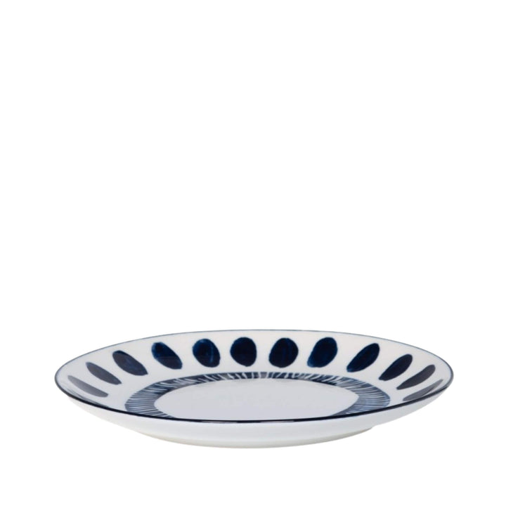 Side view of a ceramic plate highlighting its shallow profile and painted rim.