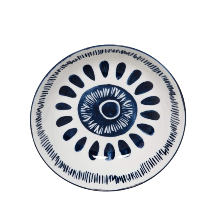 Front view of a Milos soup bowl showcasing circular blue decorative motifs.