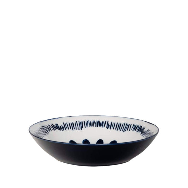 Side view of a Milos soup bowl showcasing circular blue decorative motifs.