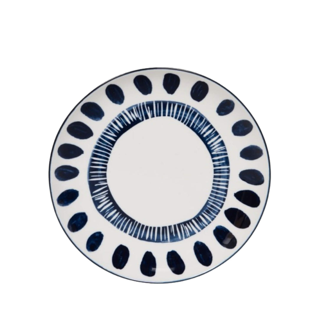 Front view of a Milos dessert plate showcasing circular blue decorative motifs.