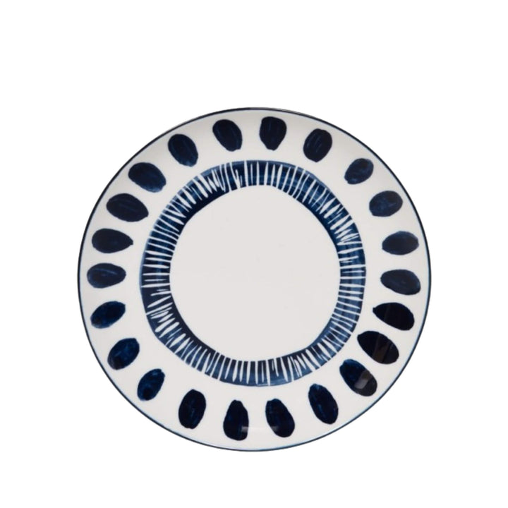 Front view of a Milos dessert plate showcasing circular blue decorative motifs.