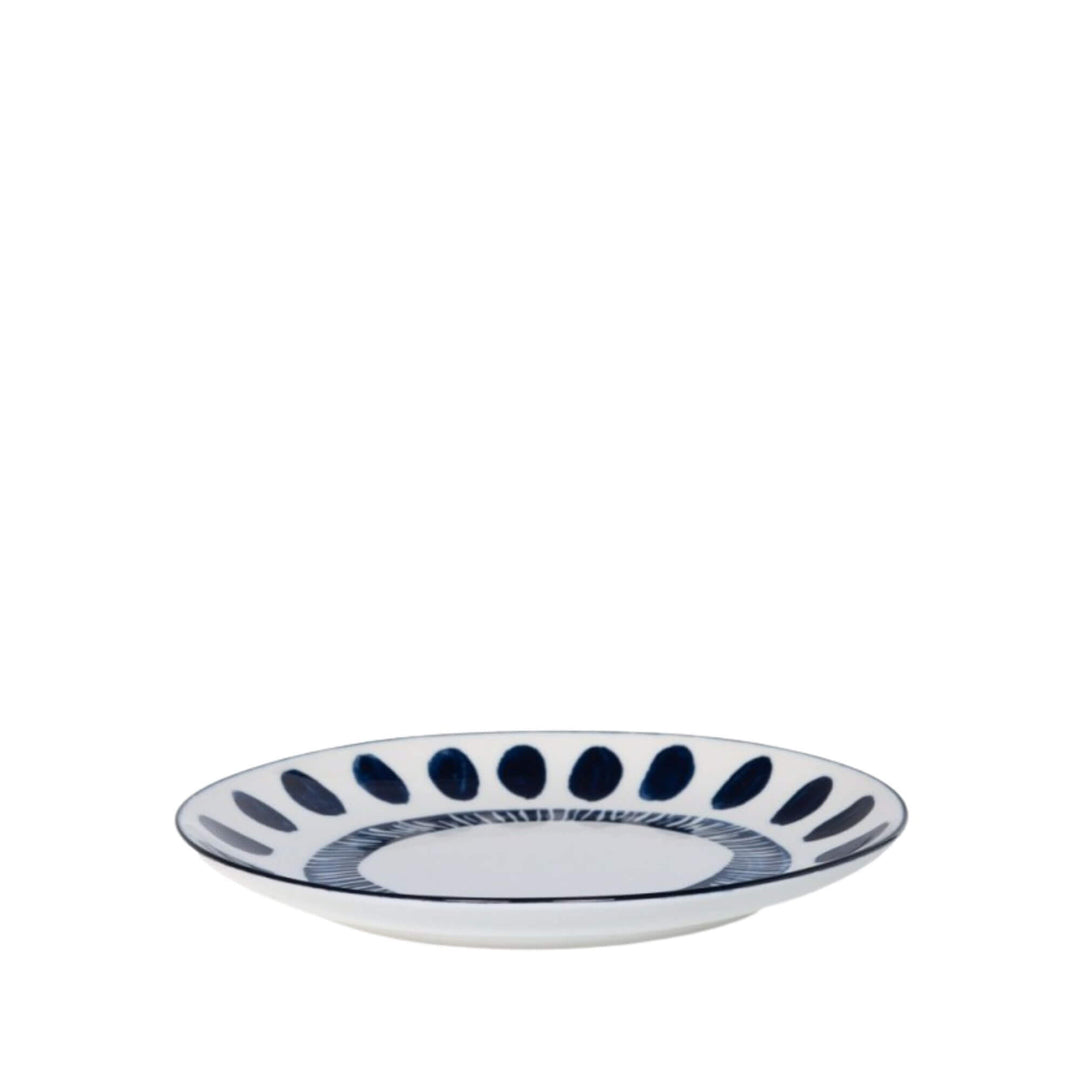 Side view of a Milos dessert plate showcasing circular blue decorative motifs.