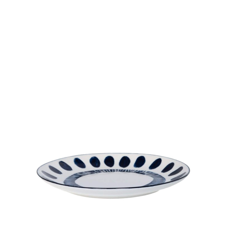 Side view of a Milos dessert plate showcasing circular blue decorative motifs.
