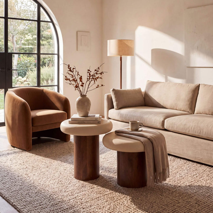 Styled living room setting featuring the Milo side tables beside a sofa in a warm contemporary interior.