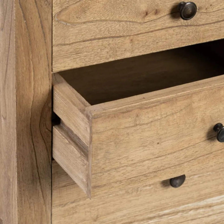 Drawer detail with metal knob on wooden bedside table