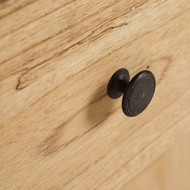 Close-up of the round knob showing the contrast between the dark handle and natural wood finish.