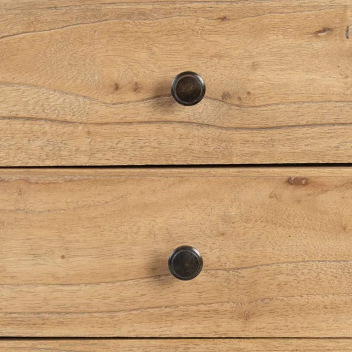 Close-up of drawer detail with metal knob on wooden bedside table