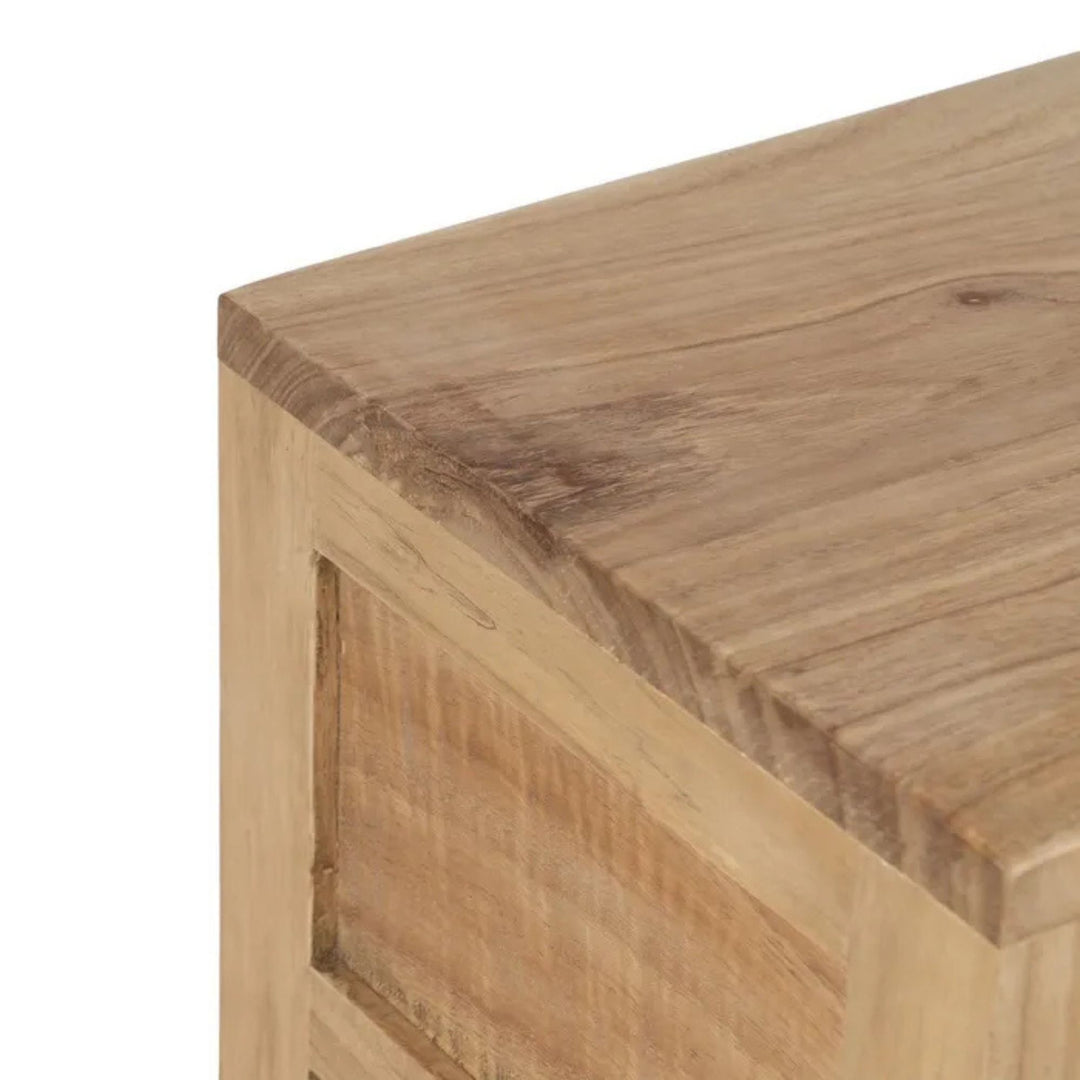 Close-up of the tabletop corner showing the natural mindi wood grain and finish.