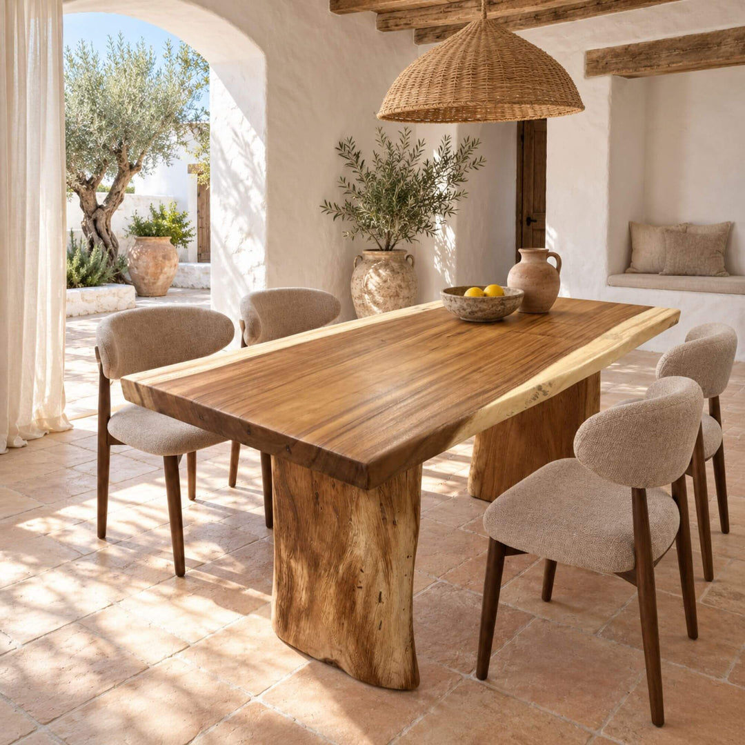 Minerva suar wood dining table styled with dining chairs in a warm Mediterranean-inspired interior