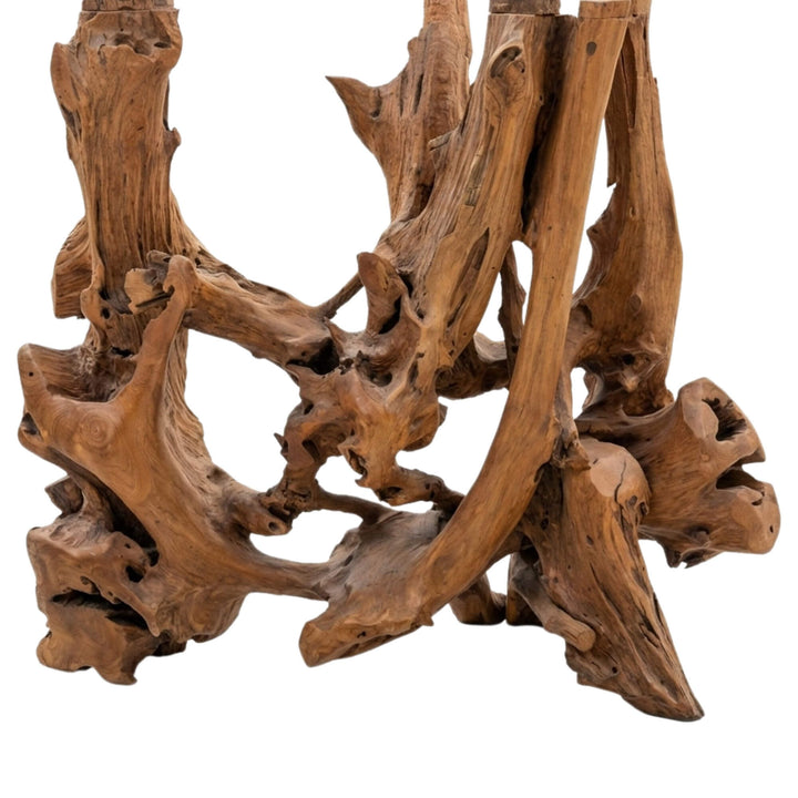 Close-up detail of the Mitra Bar Table base showing the unique teak root textures and grain.