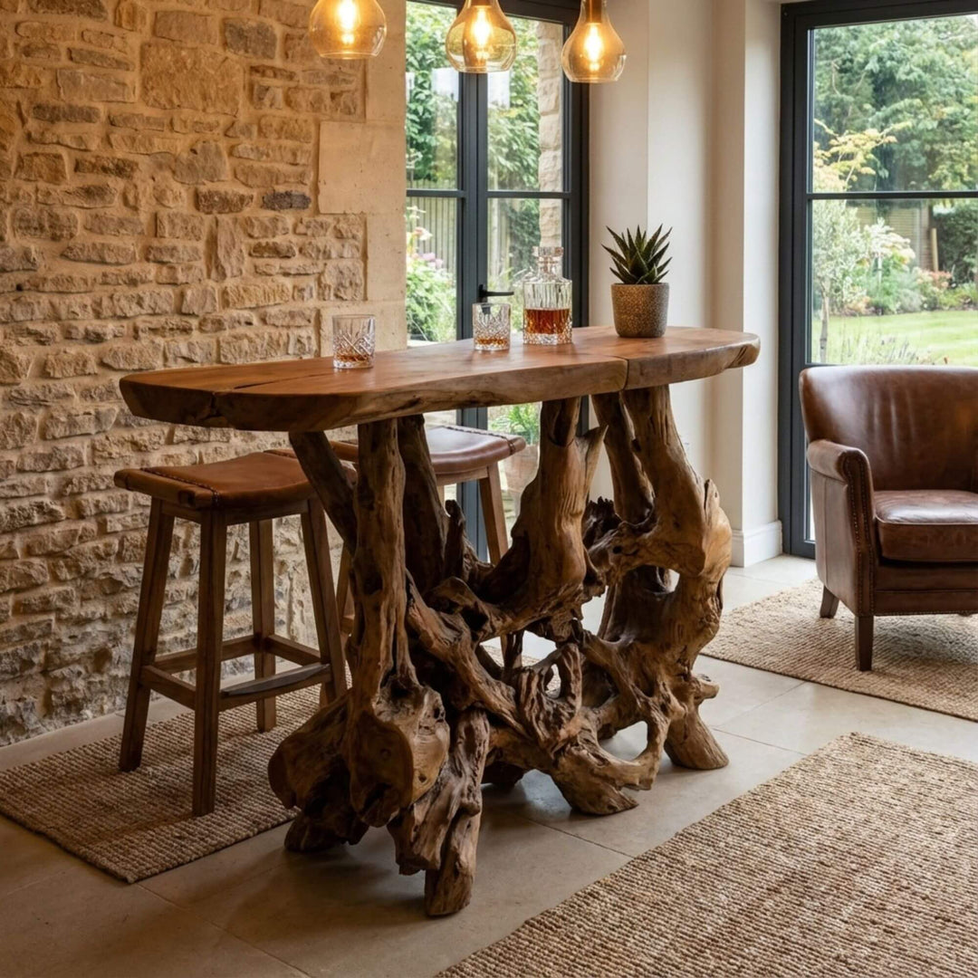Styled interior view of Mitra Bar Table placed in a dining or bar setting, highlighting its organic design.