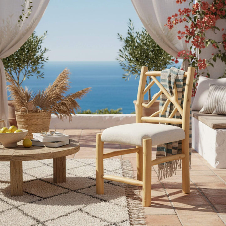 Molokai teak branch dining chair in outdoor setting