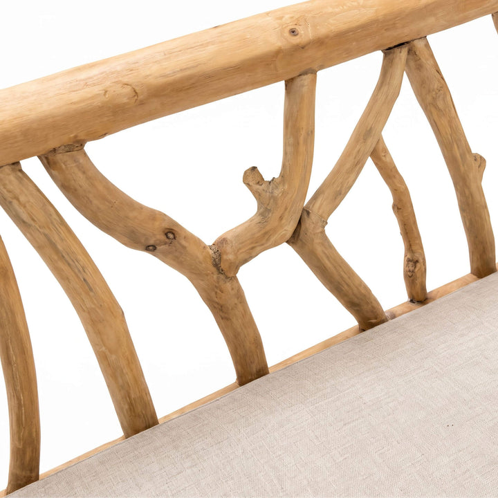 Close-up of the Molokai bench highlighting the organic teak branch backrest and natural wood texture
