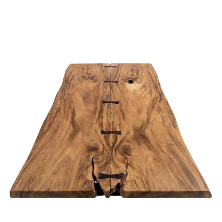 Top view of the dining table highlighting the rich suar wood grain, natural openings, and handcrafted butterfly joints.