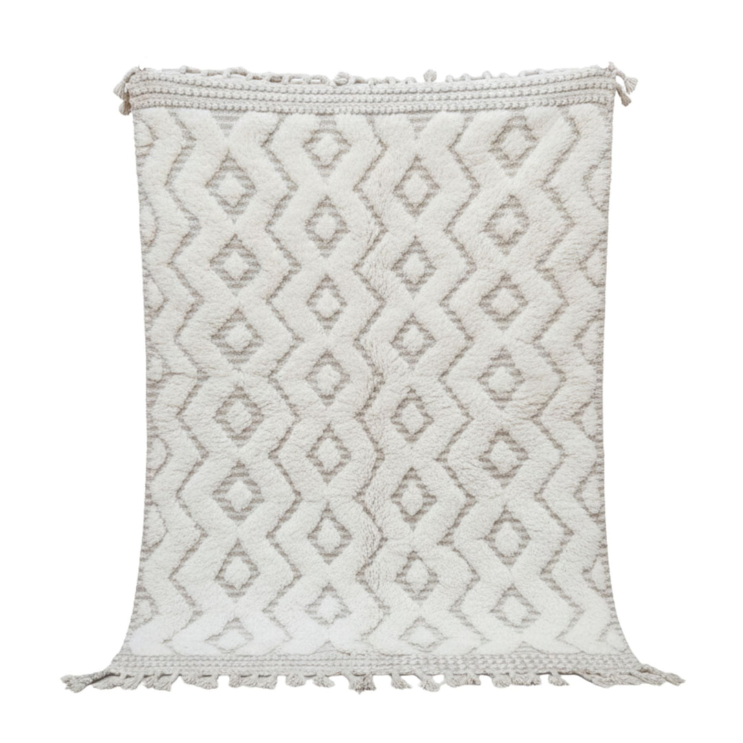 Front view of the Moroccan rug with raised cream-toned geometric pattern.