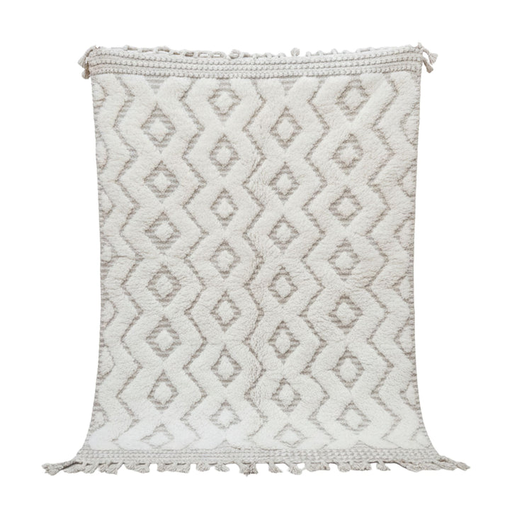 Front view of the Moroccan rug with raised cream-toned geometric pattern.