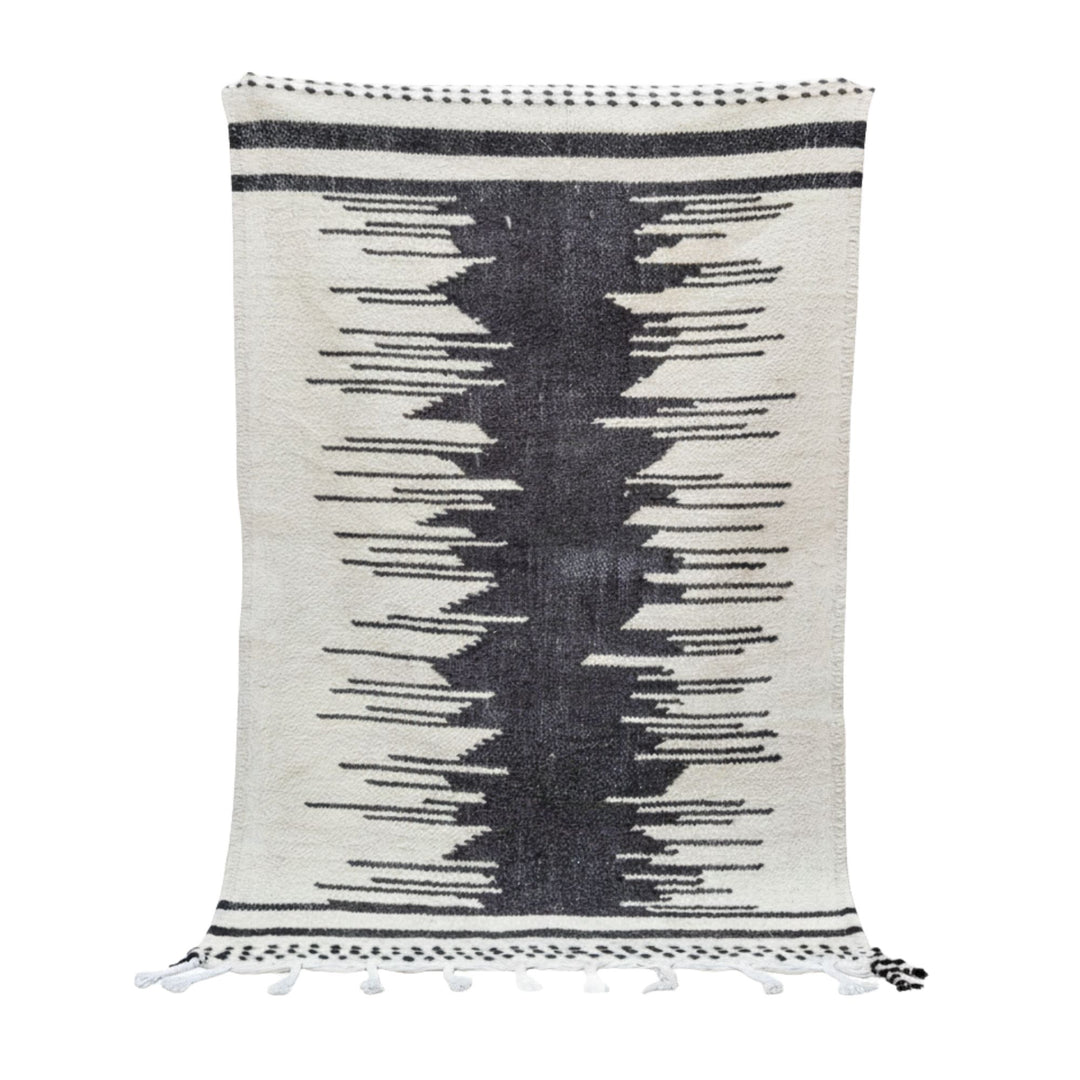 Front view of the Moroccan wool rug with bold black central motif.