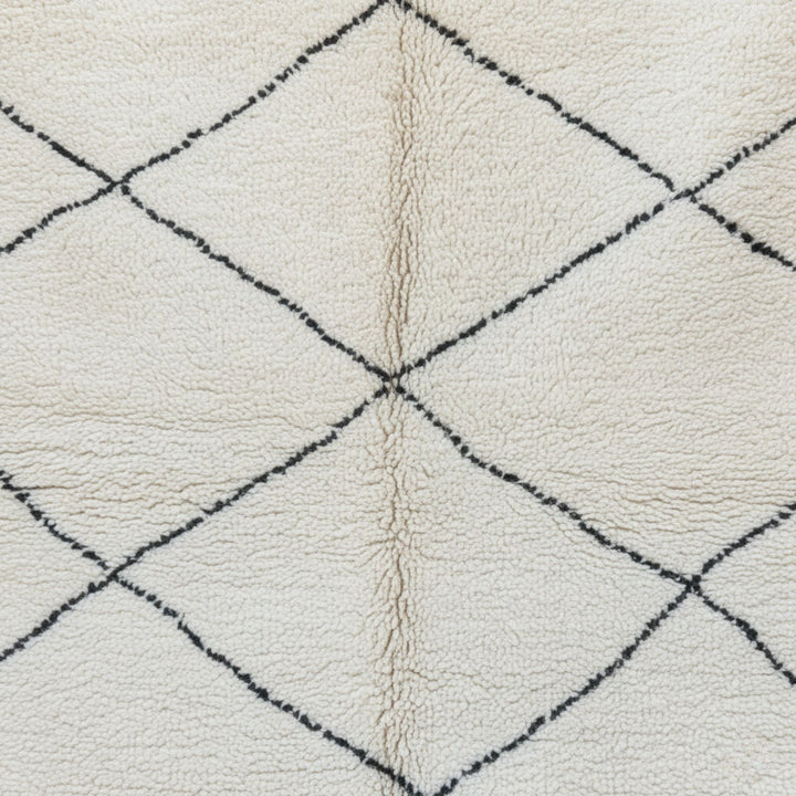 Close-up of the wool texture and handwoven Berber design.