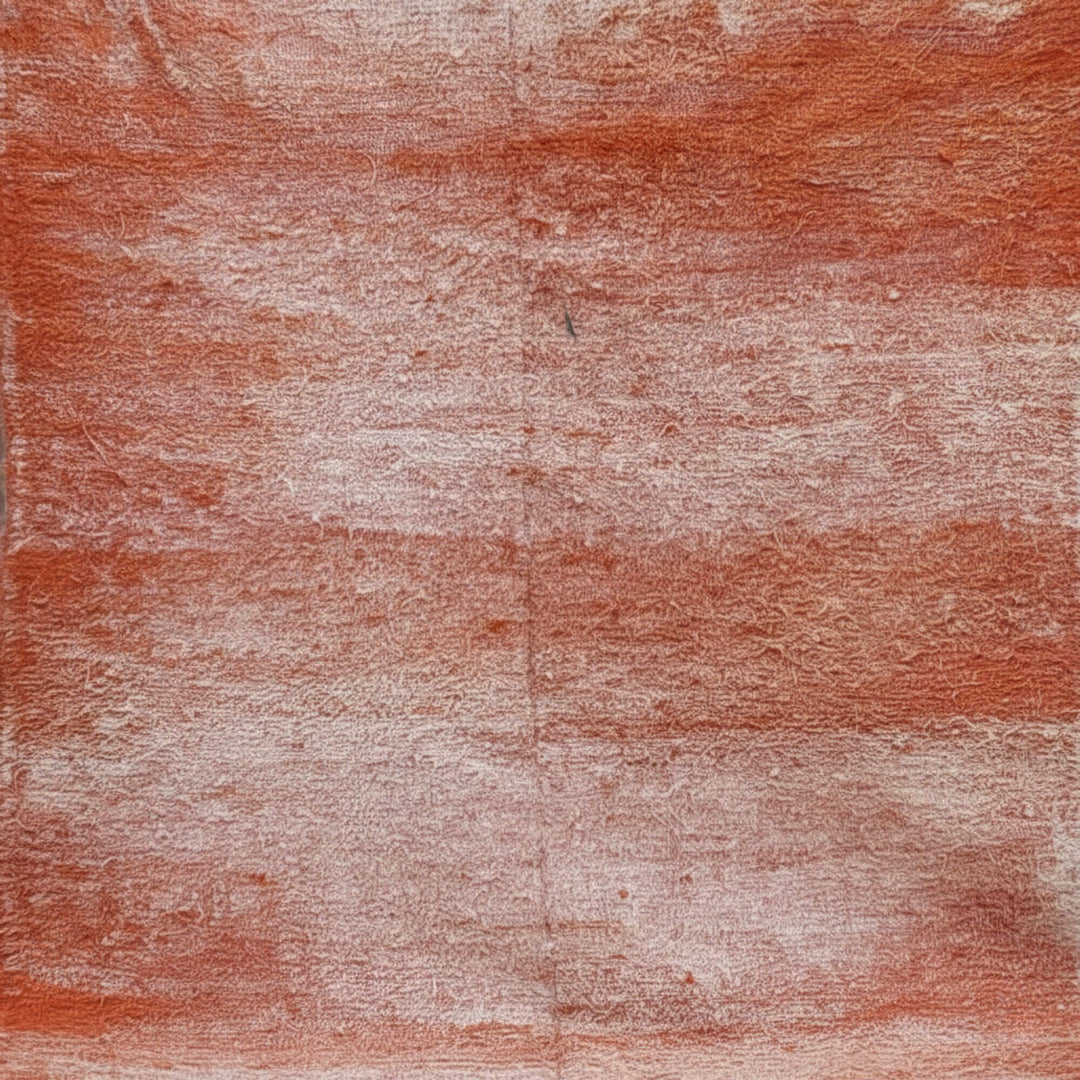 Close-up of the wool texture showing the terracotta and cream color blend.