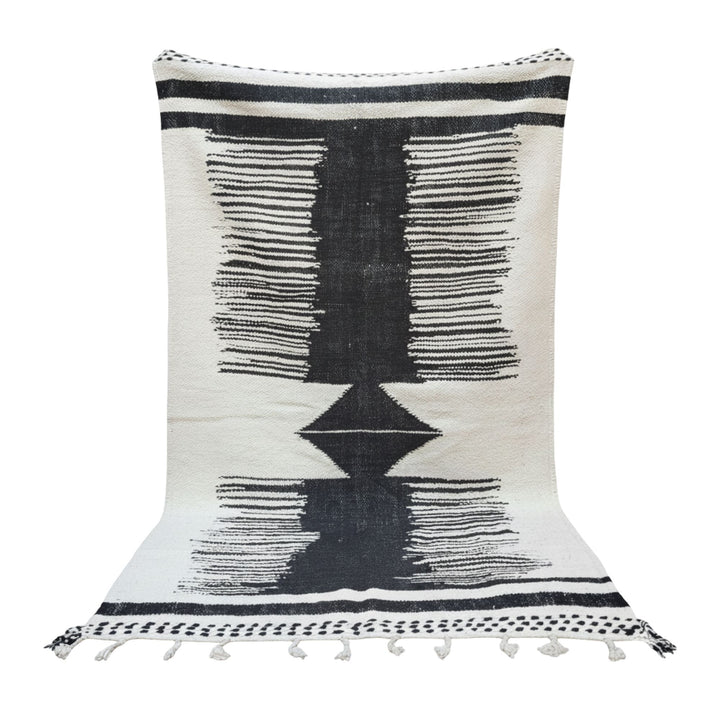 Front view of the Moroccan wool rug featuring a bold black geometric motif.