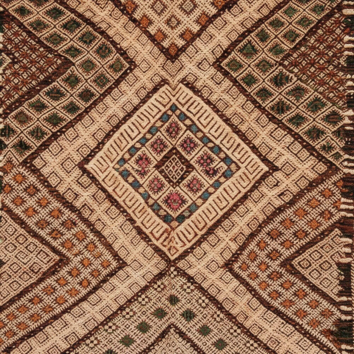 Close-up of the detailed weaving and geometric motifs in earthy tones.