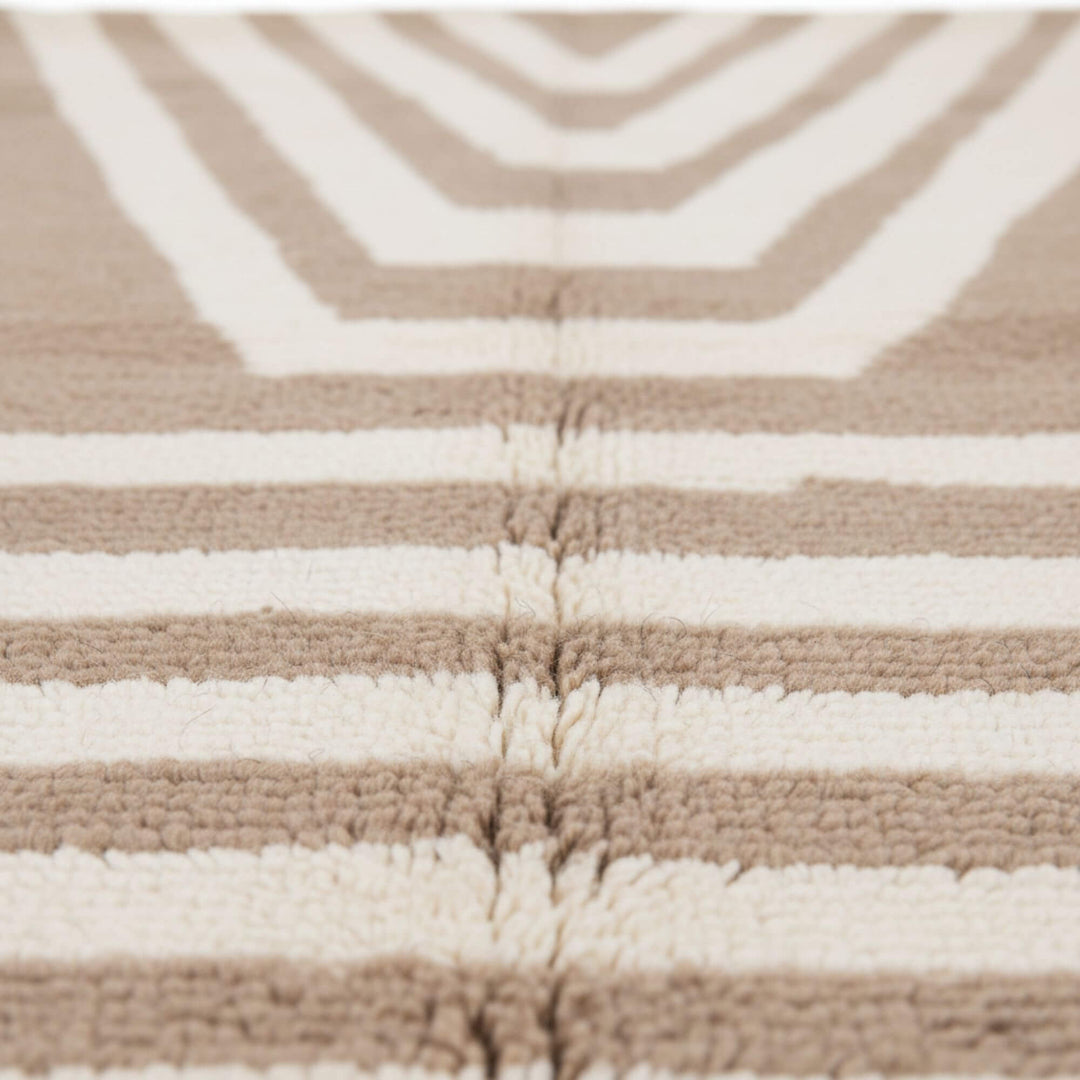 Close-up of the wool texture and artisan geometric design.