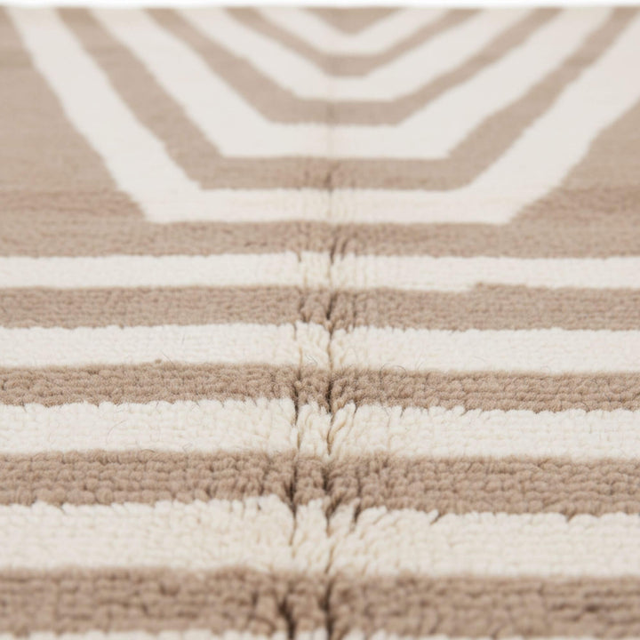 Close-up of the wool texture and artisan geometric design.