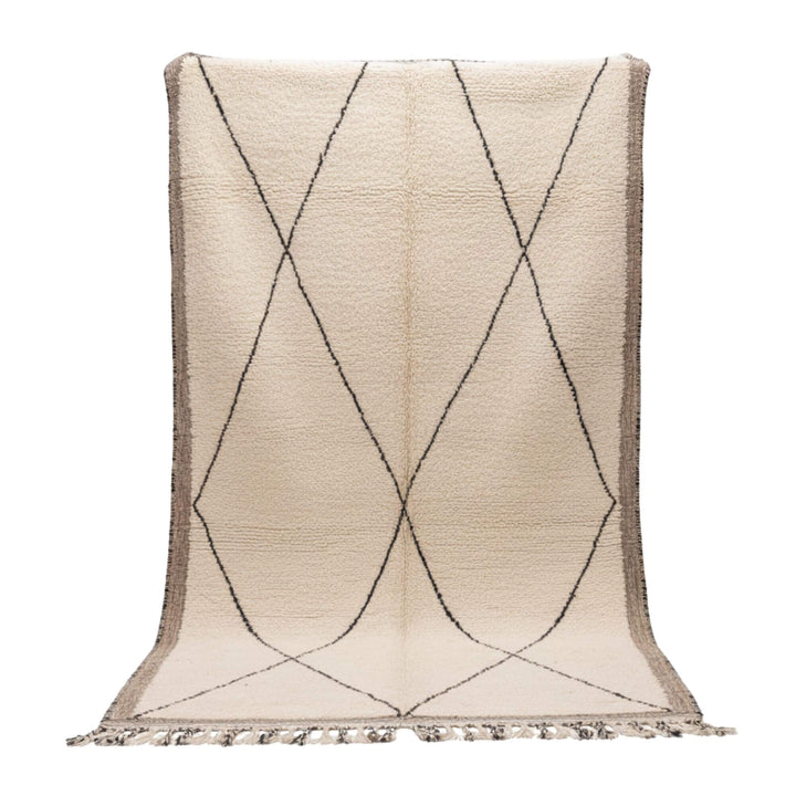 Front view of the Moroccan Rug with curved diamond pattern on a cream wool base.