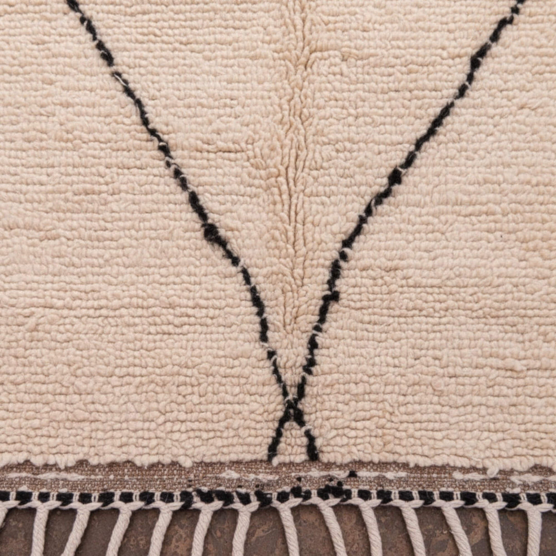 Close-up of the wool texture and curved diamond design of the Moroccan Rug.