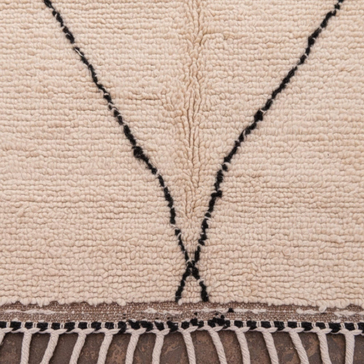 Close-up of the wool texture and curved diamond design of the Moroccan Rug.