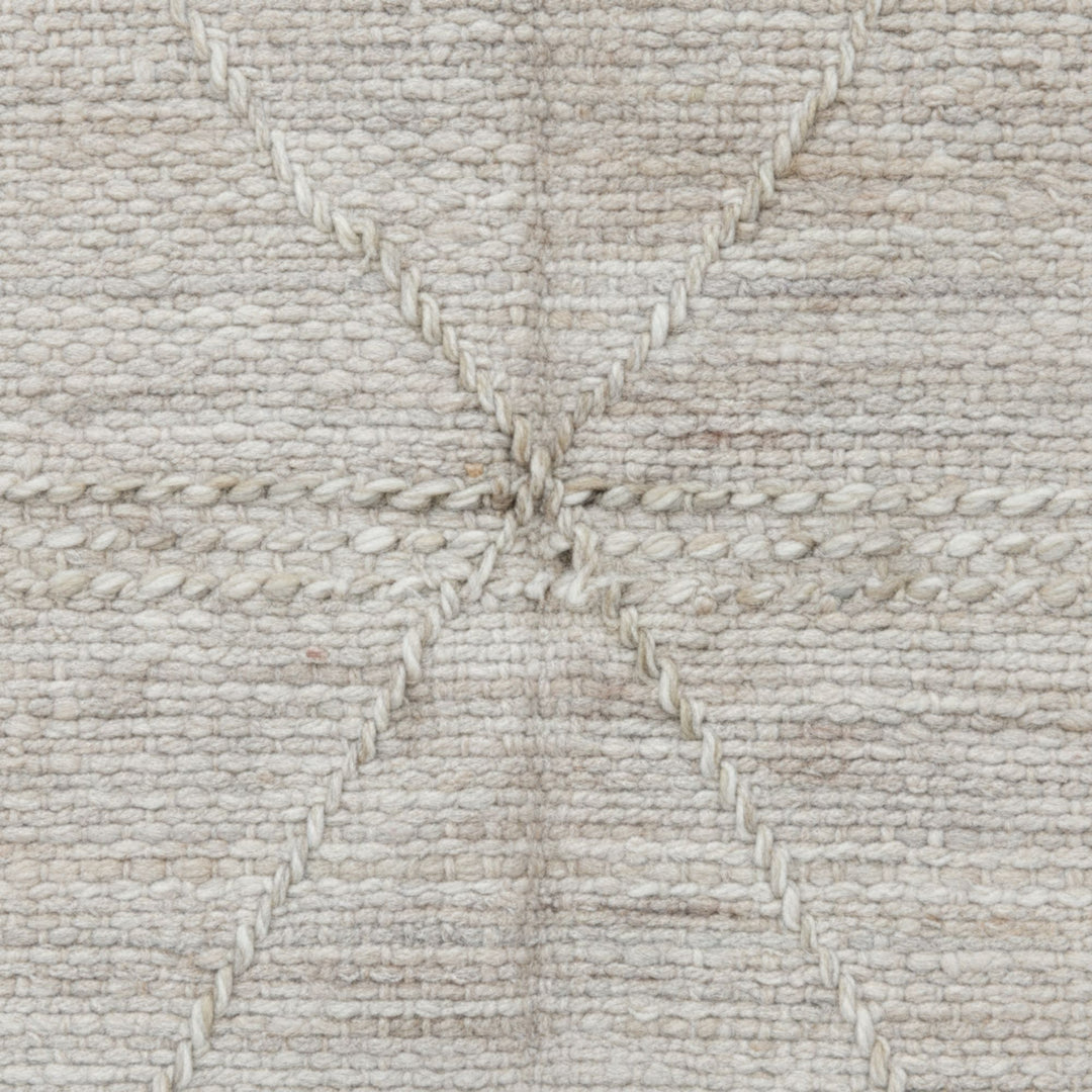 Close-up of the handwoven wool texture and detailed stitching.