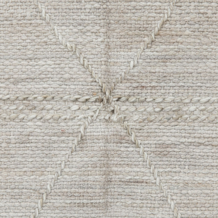 Close-up of the handwoven wool texture and detailed stitching.