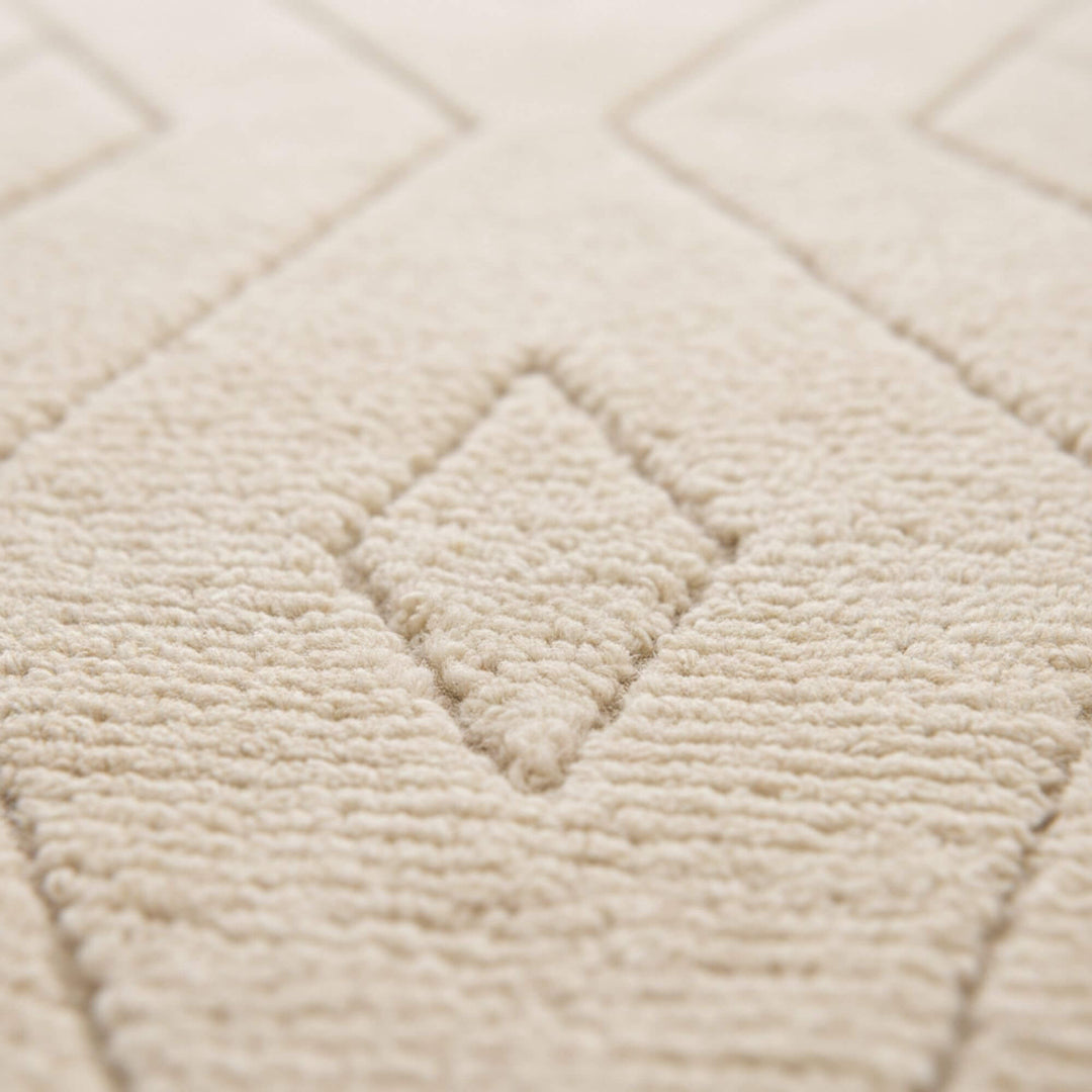 Close-up of the wool texture and subtle geometric pattern.