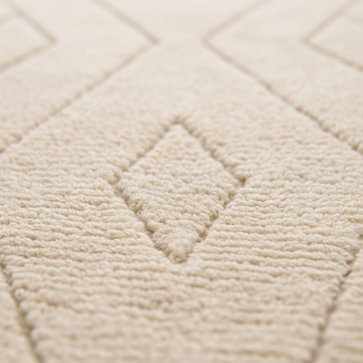 Close-up of the wool texture and subtle geometric pattern.