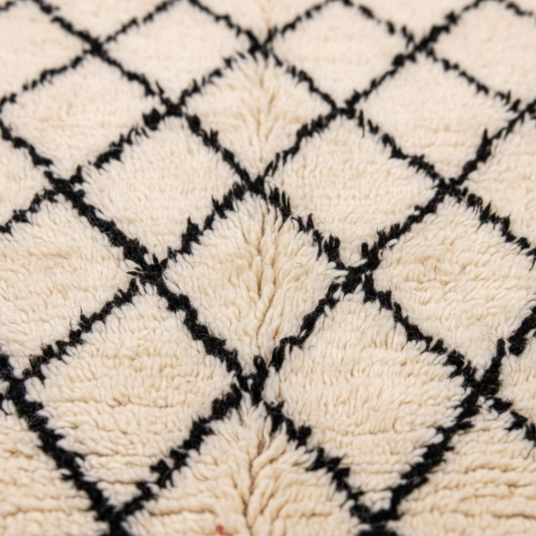 Close-up of the wool texture and diamond weave of the Moroccan Rug.