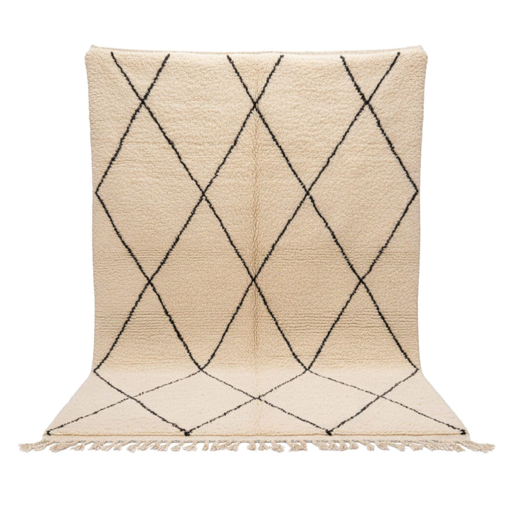 Front view of the Moroccan Rug in cream wool with black diamond pattern.