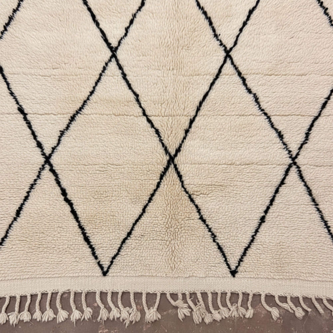 Close-up of the wool texture and diamond design of the Moroccan Rug.