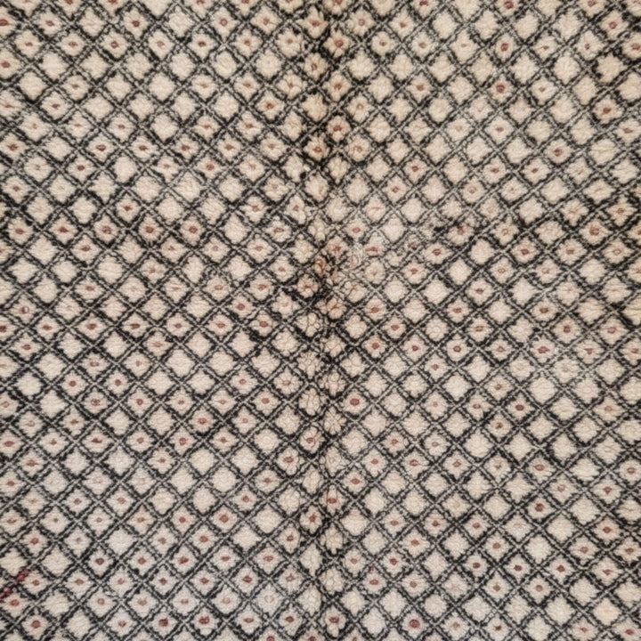Close-up of the detailed geometric weave on the Moroccan Rug.
