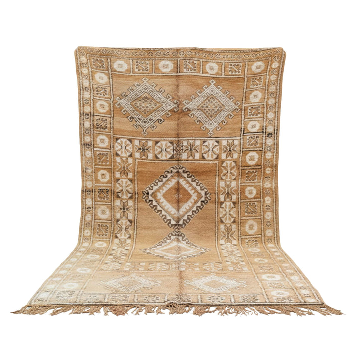 Front view of the Moroccan Rug in warm sand tones with geometric wool patterns.