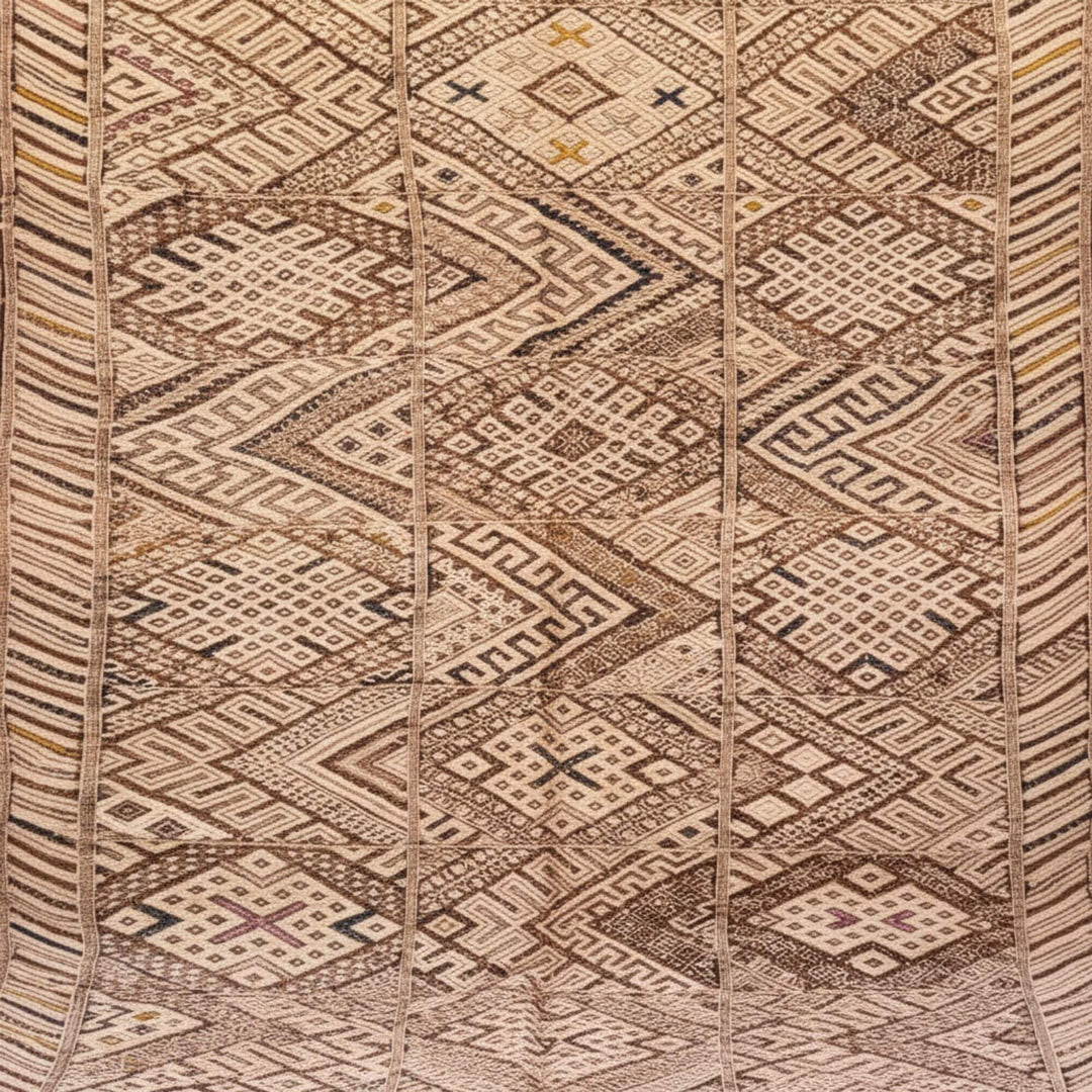 Close-up of the traditional Moroccan woven motif in natural wool tones.
