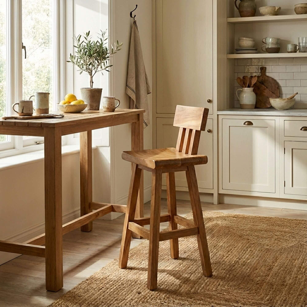 Lifestyle image of the Morotai bar stool placed at a wooden kitchen island.