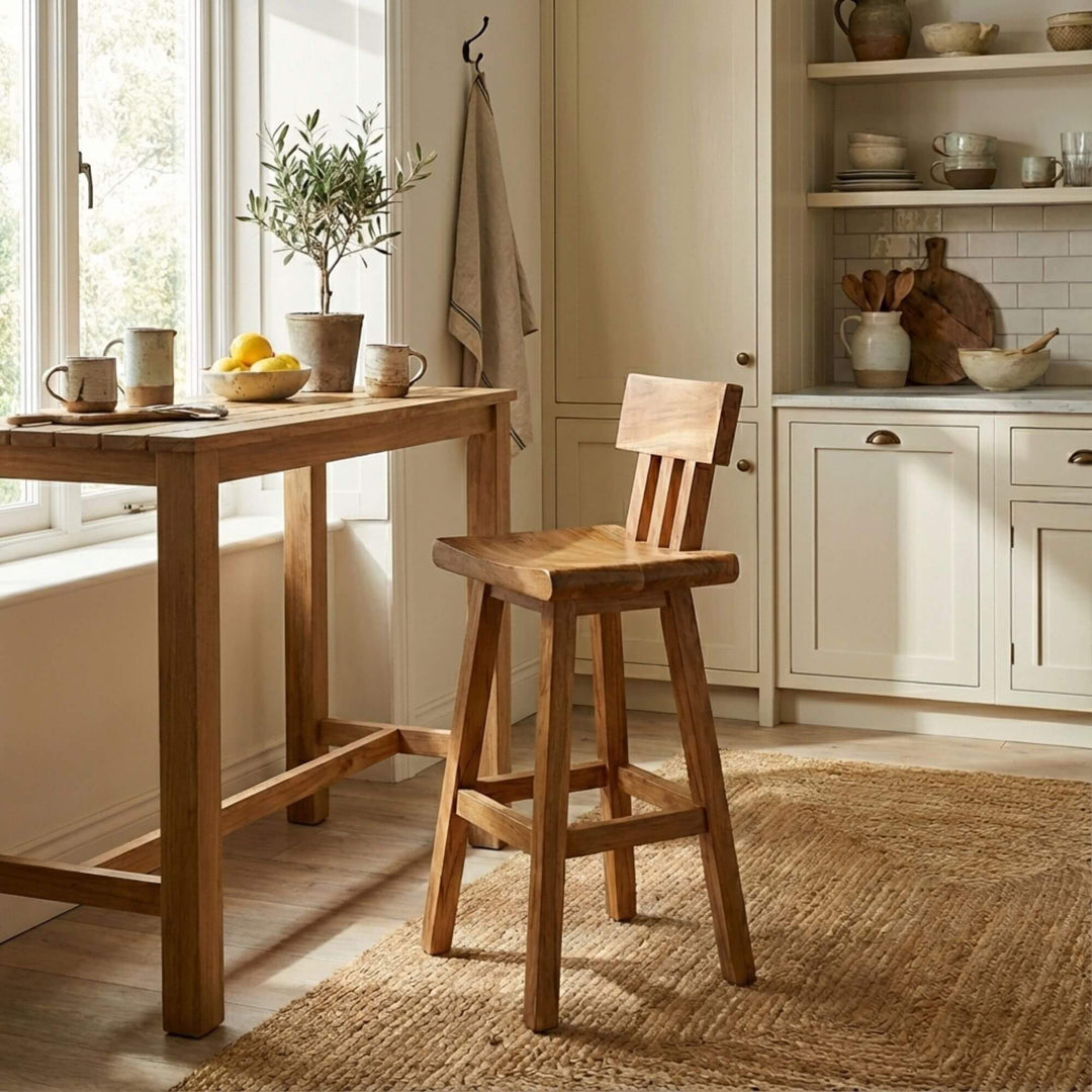 Lifestyle image of the Morotai bar stool placed at a wooden kitchen island.