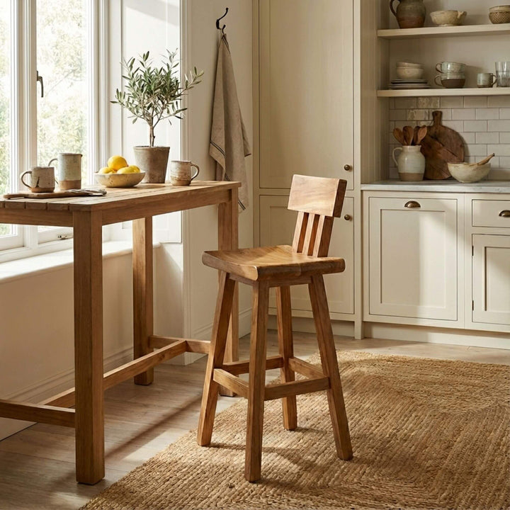 Lifestyle image of the Morotai bar stool placed at a wooden kitchen island.